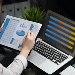 Businessman analyzing investment charts with laptop. Accounting